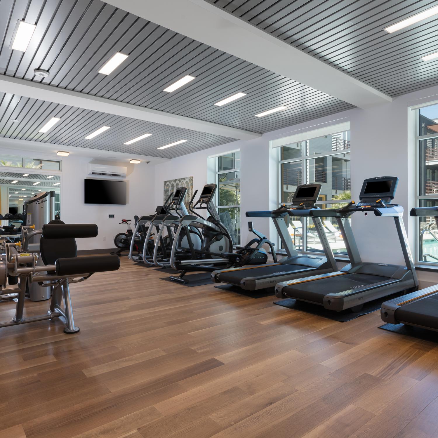 Apartments in Menlo Park CA - Expansive Fitness Center Featuring Various Cardio Equipment